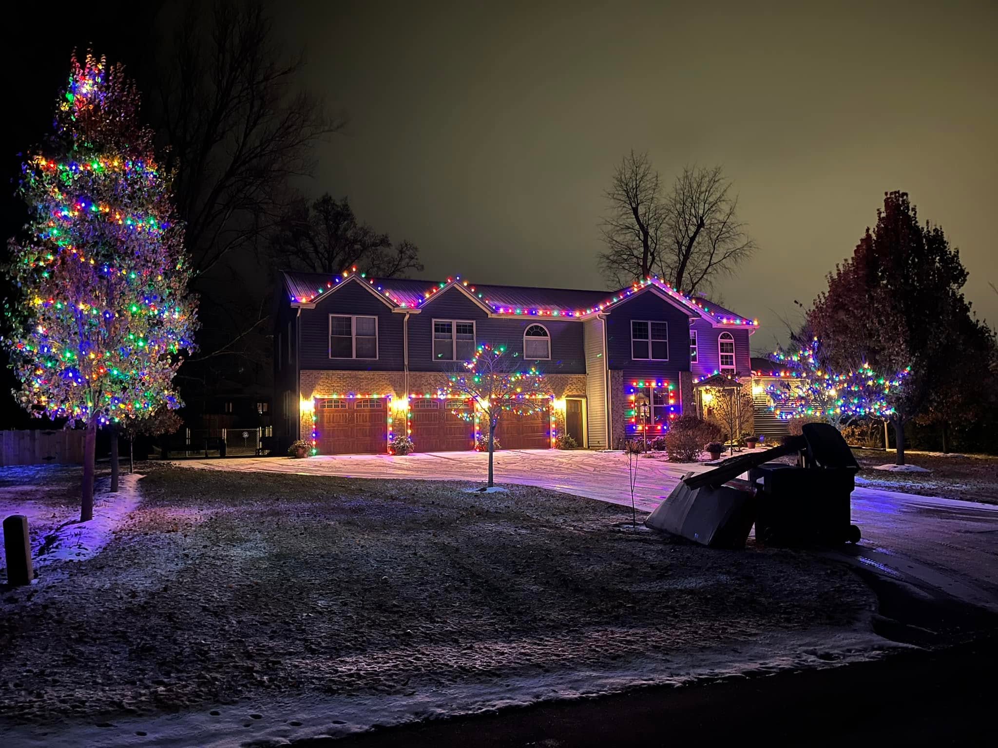 Home with warm white lights and red and green accent lighting
